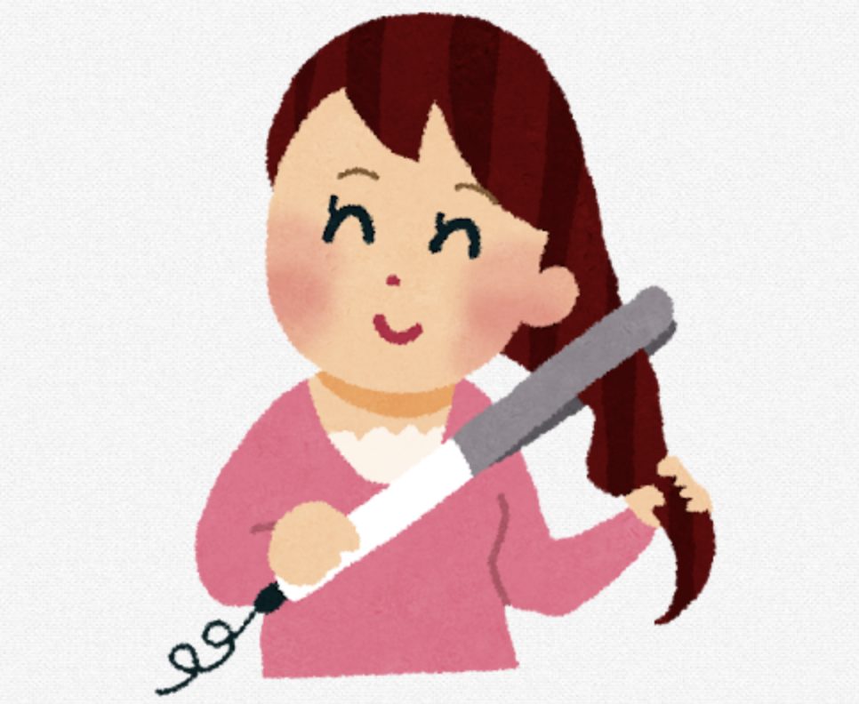 ヘアアイロンでソバージュしている女性
